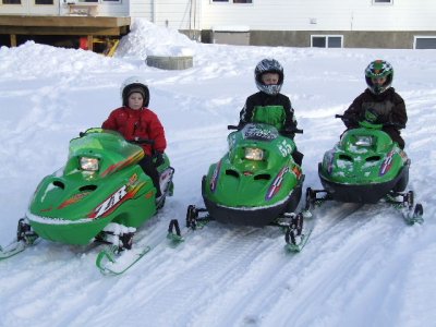 3 dudes on sleds.JPG